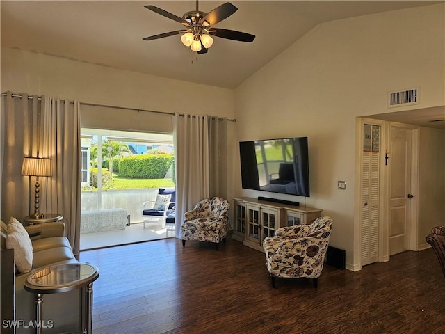 living area with high vaulted ceiling, a ceiling fan, visible vents, and wood finished floors