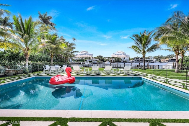 view of swimming pool with a water view