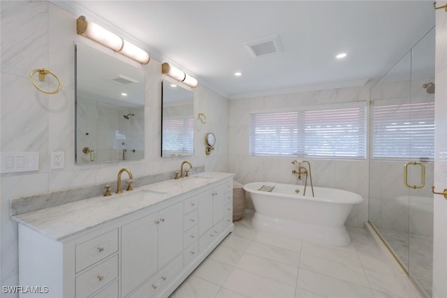 bathroom featuring tile walls, tile patterned flooring, vanity, and separate shower and tub