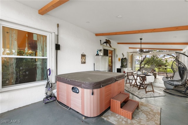 view of patio / terrace with a hot tub