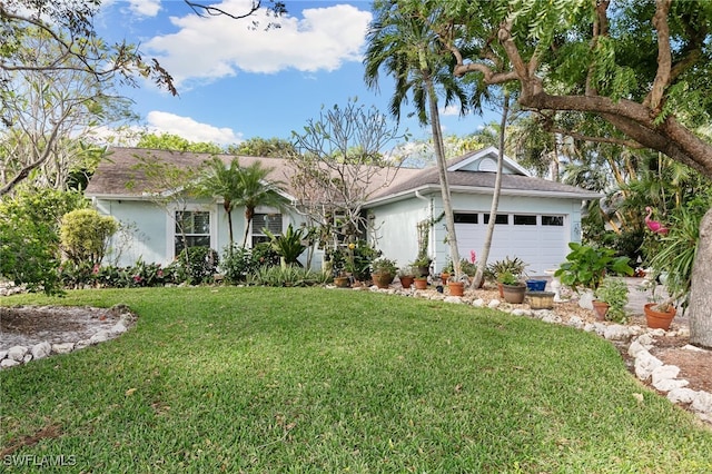 single story home with a garage and a front yard