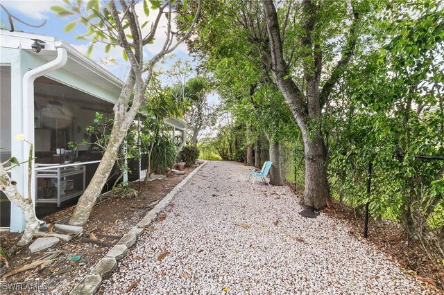 120 Sand Hill St, Marco Island, FL 34145 - view of yard with a sunroom