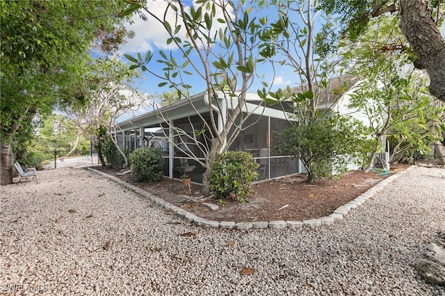 exterior space featuring a lanai and a sunroom