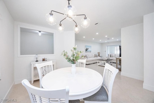 4126 Belair Ln Unit C6, Naples, FL 34103 - dining room featuring a chandelier, baseboards, light tile patterned flooring, and recessed lighting