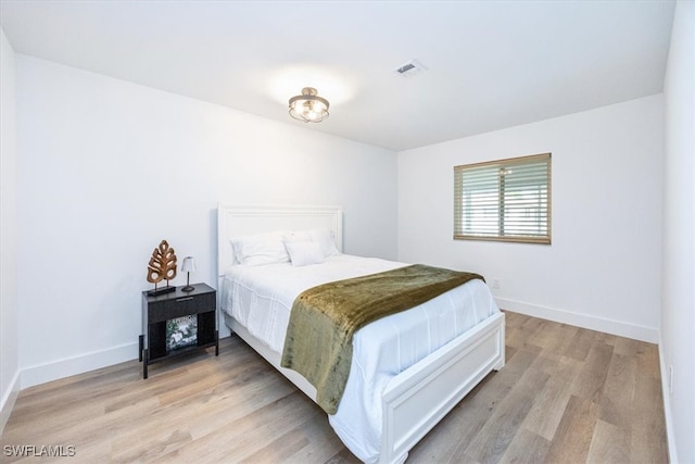 bedroom with light hardwood / wood-style flooring