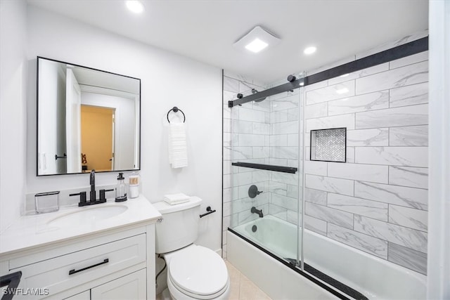 full bathroom featuring bath / shower combo with glass door, vanity, and toilet