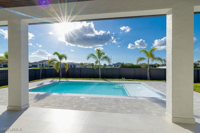 view of swimming pool with a patio