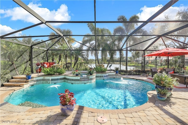 view of swimming pool with a lanai, a patio, a water view, and pool water feature