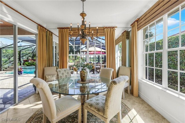 tiled dining space with a notable chandelier and crown molding