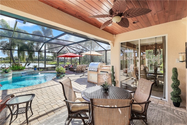 view of patio / terrace with a water view, ceiling fan, a lanai, area for grilling, and pool water feature