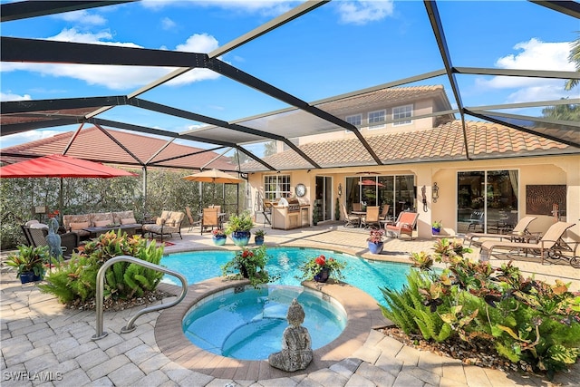 view of pool with a lanai, an in ground hot tub, a patio, and an outdoor living space