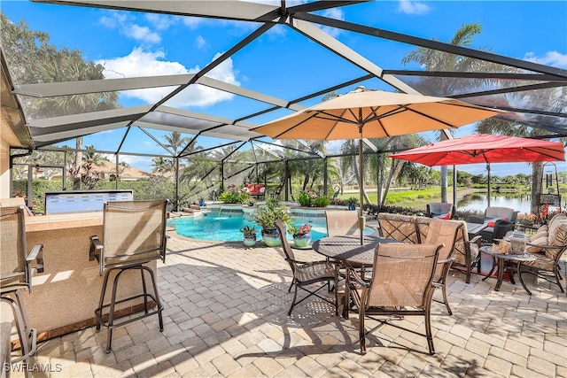 view of patio featuring a water view, a lanai, and pool water feature