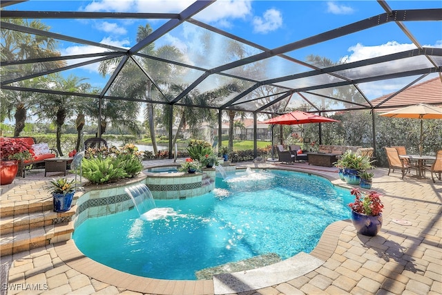 view of swimming pool featuring an in ground hot tub, a patio area, glass enclosure, and pool water feature