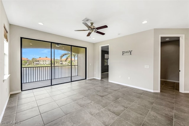 spare room with ceiling fan