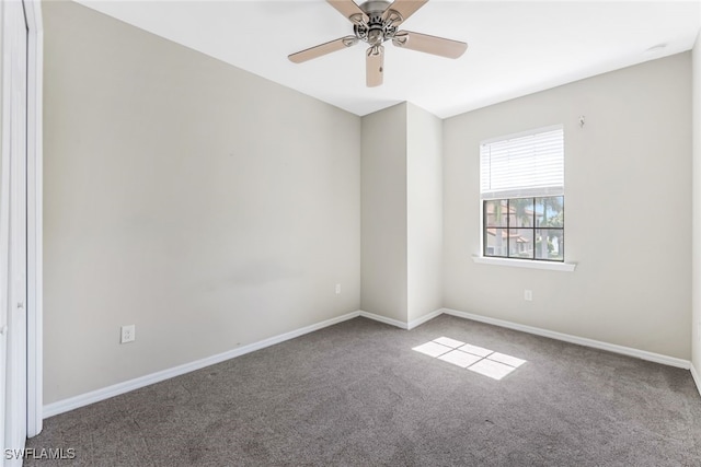 unfurnished room with carpet flooring and ceiling fan