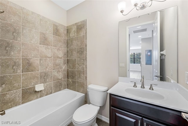 full bathroom featuring vanity, toilet, and tiled shower / bath