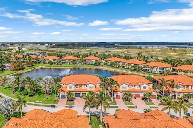 bird's eye view with a residential view and a water view