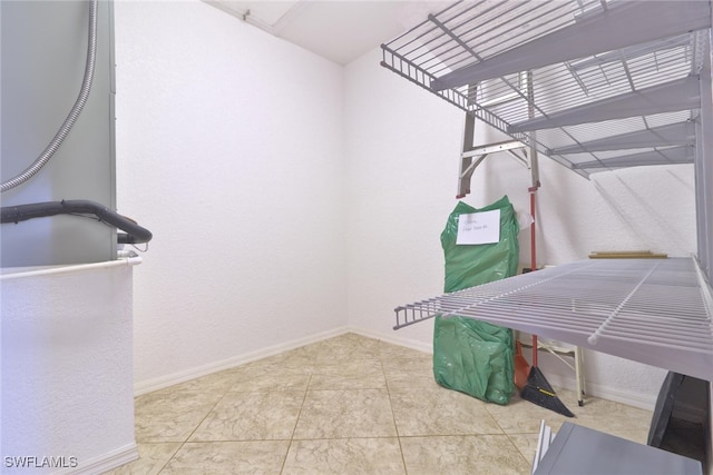 walk in closet featuring tile patterned flooring