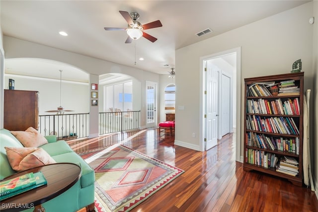 sitting room featuring dark wood-type flooring