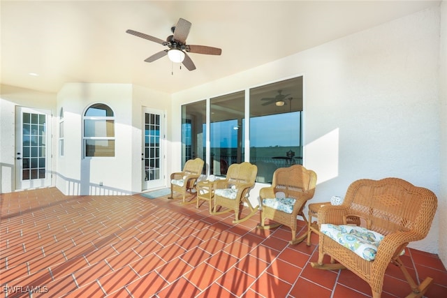 view of patio featuring ceiling fan