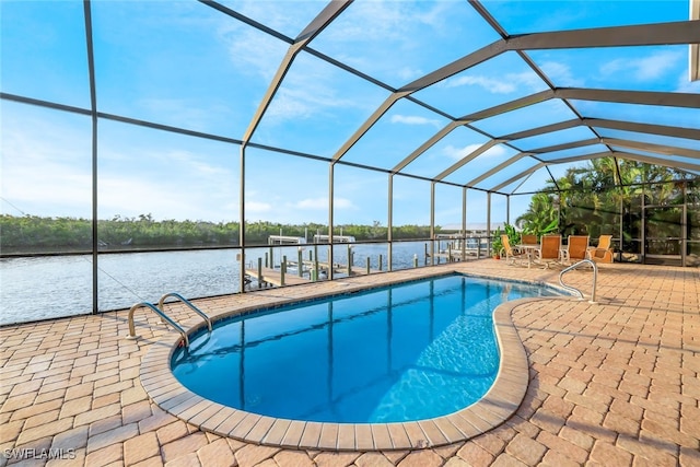 view of pool featuring a patio, a water view, a lanai, and a boat dock