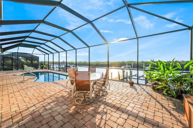 view of swimming pool with a lanai and a patio area