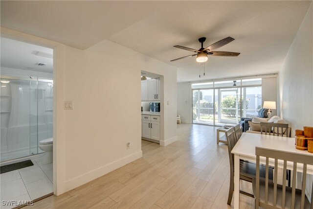 dining room featuring ceiling fan and light hardwood / wood-style flooring