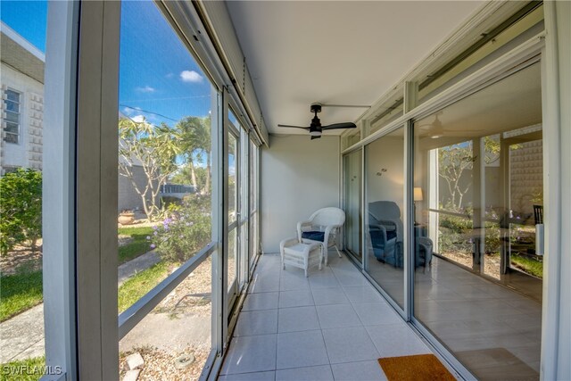 unfurnished sunroom with ceiling fan and a wealth of natural light