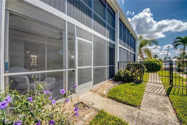 view of side of home featuring a sunroom