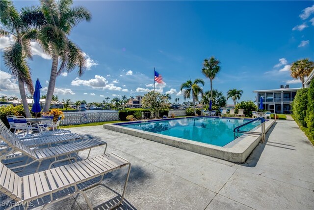 view of swimming pool featuring a patio area