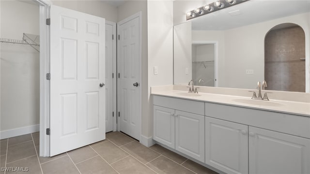 bathroom with vanity and tile patterned floors