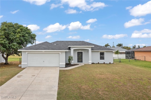 single story home featuring a garage and a front yard