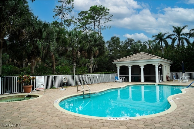 view of swimming pool featuring a patio area