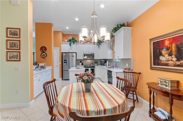 tiled dining area featuring sink, a notable chandelier, and crown molding