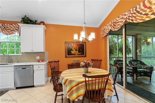 dining room with lofted ceiling, light tile patterned floors, a healthy amount of sunlight, and crown molding