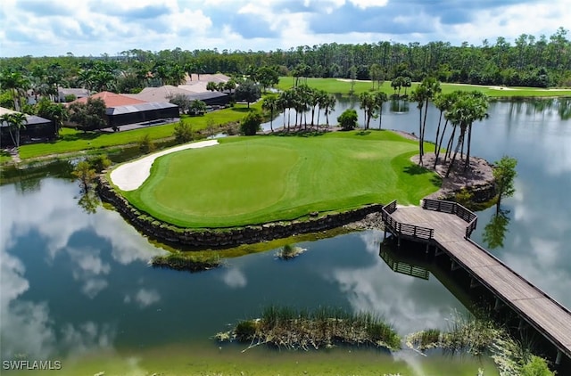 view of home's community featuring a water view and a lawn