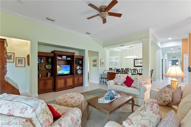 living room featuring decorative columns, ceiling fan with notable chandelier, light tile patterned floors, and ornamental molding