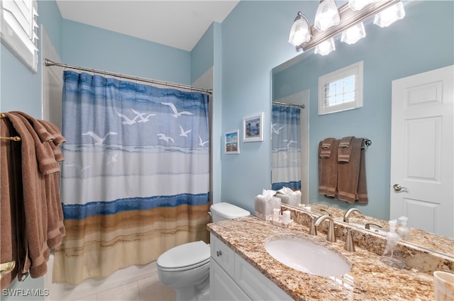 bathroom featuring toilet, a shower with curtain, vanity, and tile patterned flooring