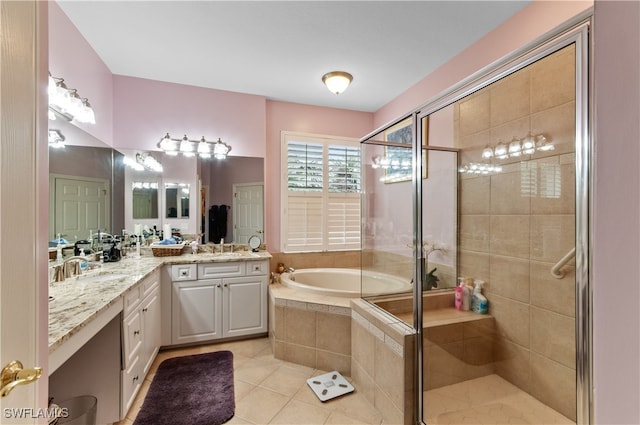 bathroom with vanity, tile patterned floors, and plus walk in shower