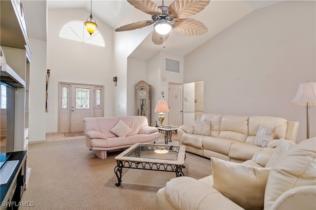 living room with ceiling fan, plenty of natural light, and high vaulted ceiling