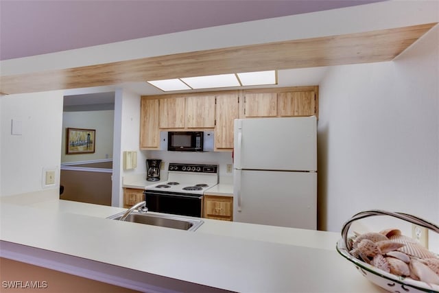 kitchen featuring kitchen peninsula, light brown cabinetry, sink, and white appliances