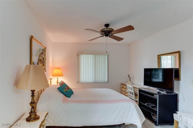 bedroom featuring light hardwood / wood-style floors and ceiling fan