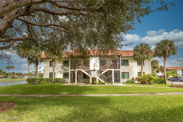 4351 27th Ct SW Unit 203, Naples, FL 34116 - view of property with stairs and a water view