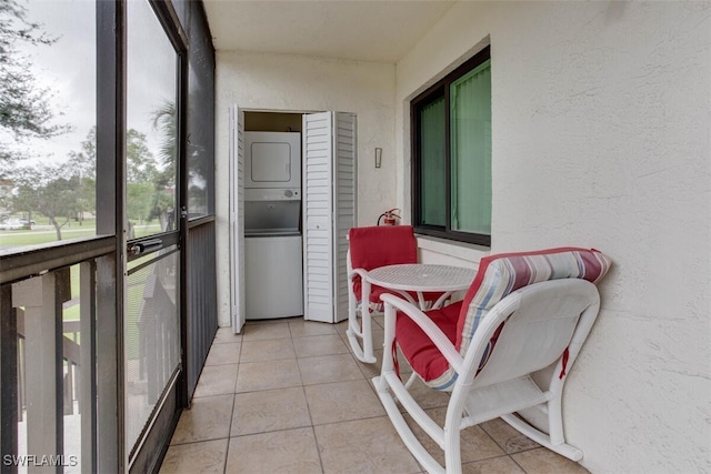 4351 27th Ct SW Unit 203, Naples, FL 34116 - sunroom / solarium featuring stacked washer / drying machine