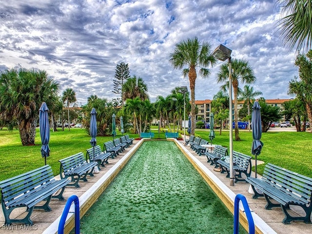 4351 27th Ct SW Unit 203, Naples, FL 34116 - surrounding community featuring a bocce ball area and a yard