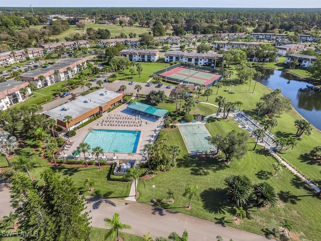 birds eye view of property featuring a water view