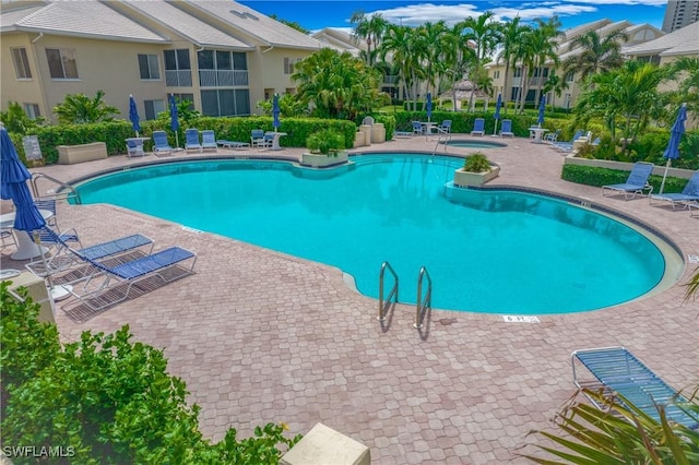 view of swimming pool featuring a patio area