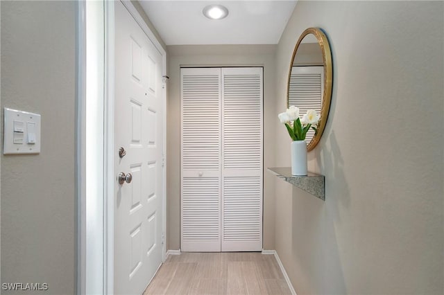 doorway featuring baseboards