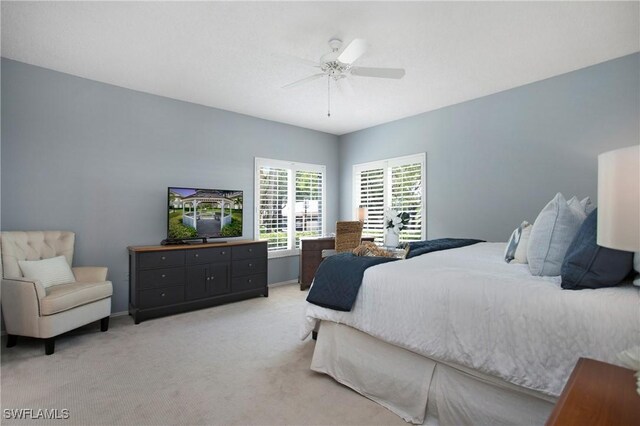 bedroom with ceiling fan and carpet