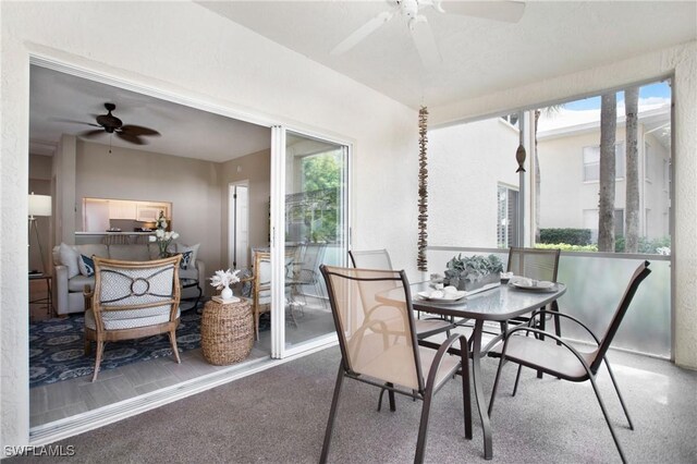 sunroom with ceiling fan and a healthy amount of sunlight